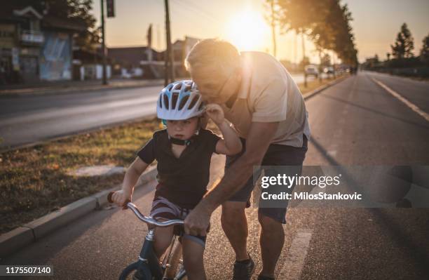 bicycling with my grandpa - grandpa son stock pictures, royalty-free photos & images