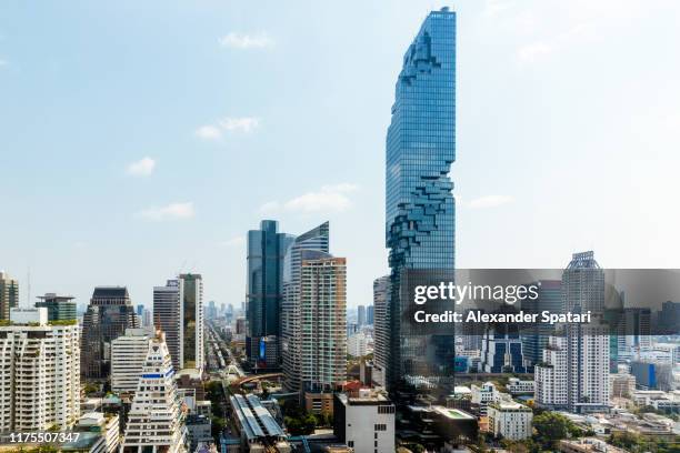 aerial view of bangkok cityscape with futuristic skyscrapers - bangkok street stock pictures, royalty-free photos & images