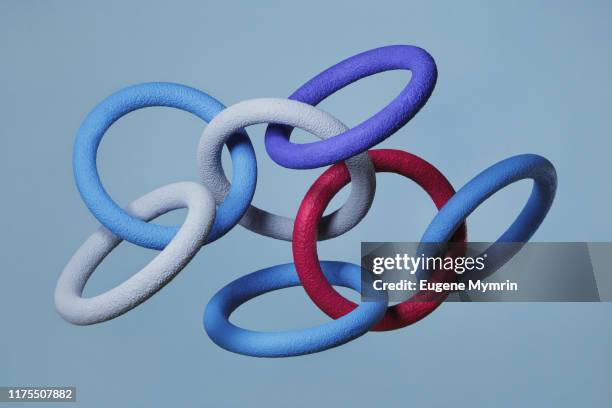 abstract multi-colored objects levitation in mid air on blue background - community networks stock-fotos und bilder
