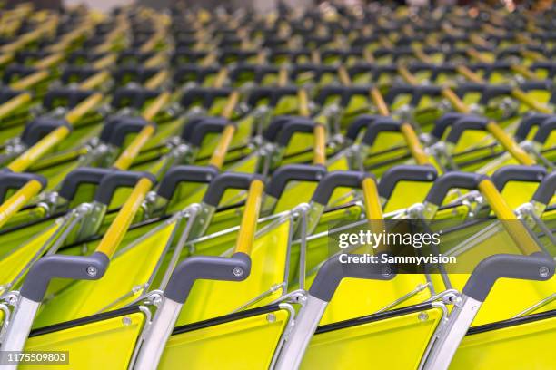 shoppping carts parking in the supermarket - shopping abstract stockfoto's en -beelden