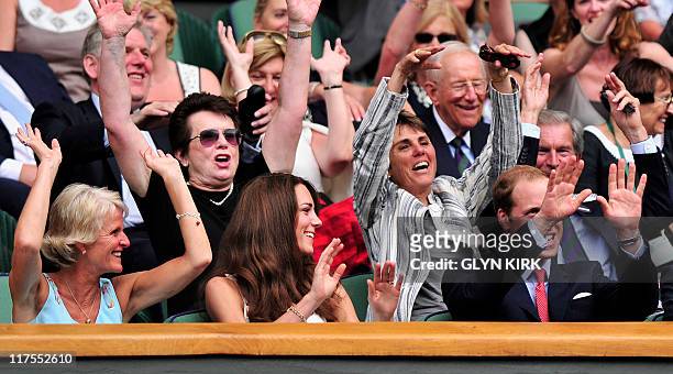 Catherine, the Duchess of Cambridge, takes part in a 'Mexican Wave' with her husband Prince William as they watch Spanish player Rafael Nadal...