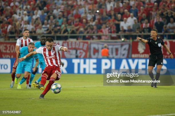 Mathieu Valbuena of Olympiacos scores his sides second goal from the penalty spot during the UEFA Champions League group B match between Olympiacos...