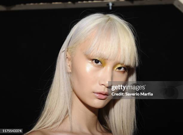 Model prepares backstage for Annakiki fashion show during the Milan Fashion Week Spring/Summer 2020 on September 18, 2019 in Milan, Italy.