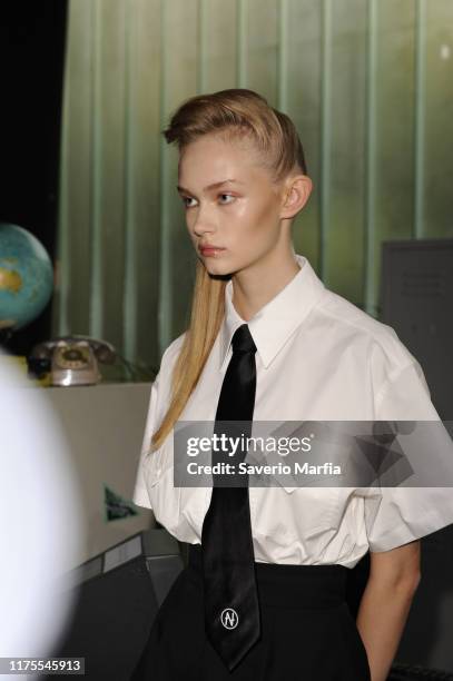 Model prepares backstage for Annakiki fashion show during the Milan Fashion Week Spring/Summer 2020 on September 18, 2019 in Milan, Italy.