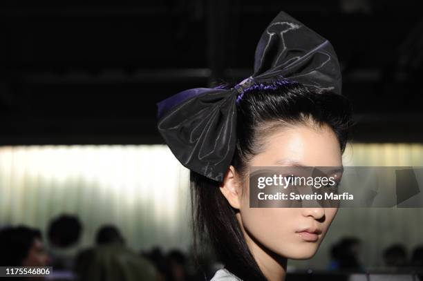 Model prepares backstage for Annakiki fashion show during the Milan Fashion Week Spring/Summer 2020 on September 18, 2019 in Milan, Italy.