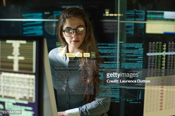 monitors woman see thru data - data stock pictures, royalty-free photos & images