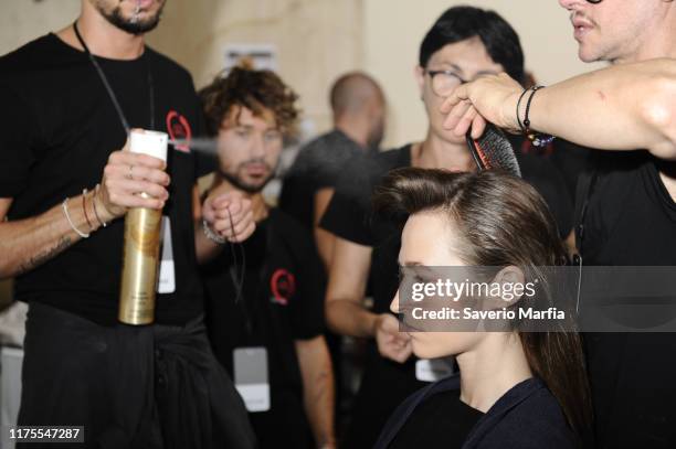 Model prepares backstage for Annakiki fashion show during the Milan Fashion Week Spring/Summer 2020 on September 18, 2019 in Milan, Italy.