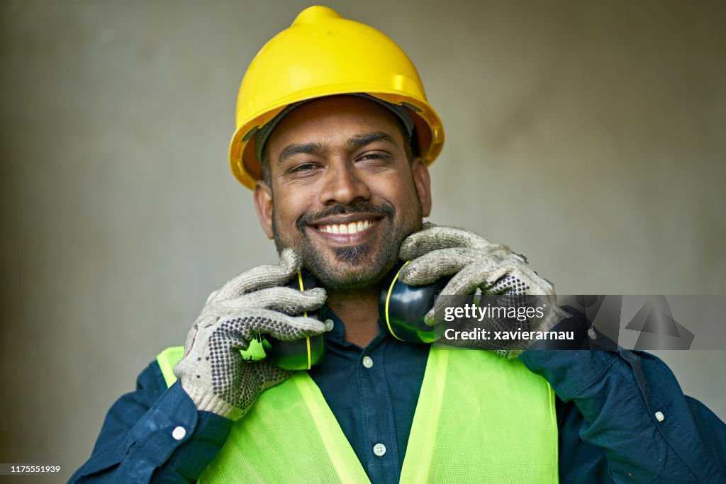 Close-up portrait of confident male engineer