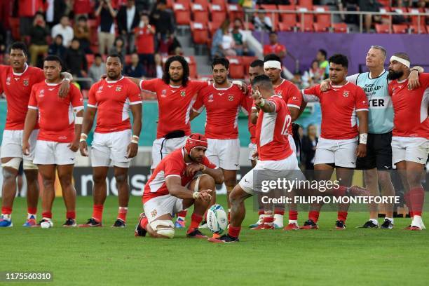 Tonga's centre Siale Piutau kicks a conversion during the Japan 2019 Rugby World Cup Pool C match between the United States and Tonga at the Hanazono...
