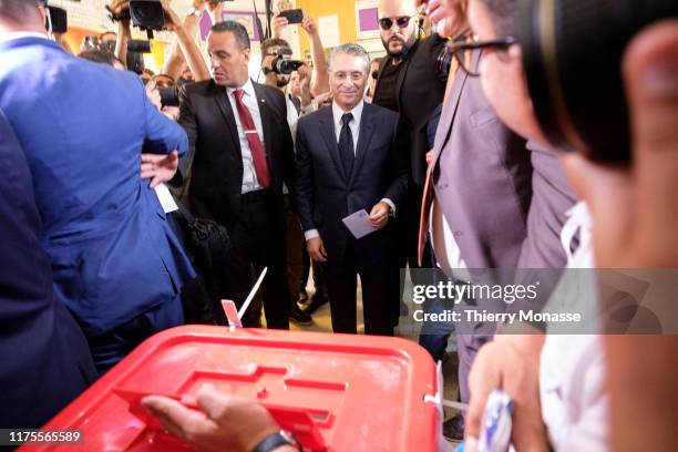 Tunisian presidential candidate, Media mogul Nabil Karoui casts his ballot during the second round of the presidential election on October 13, 2019...