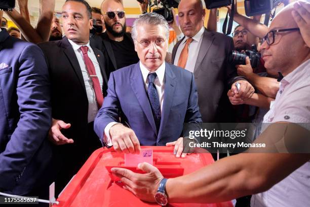 Tunisian presidential candidate, Media mogul Nabil Karoui casts his ballot during the second round of the presidential election on October 13, 2019...