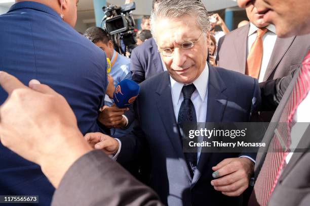 Tunisian presidential candidate, Media mogul Nabil Karoui is talking to media after he casts his ballot during the second round of the presidential...
