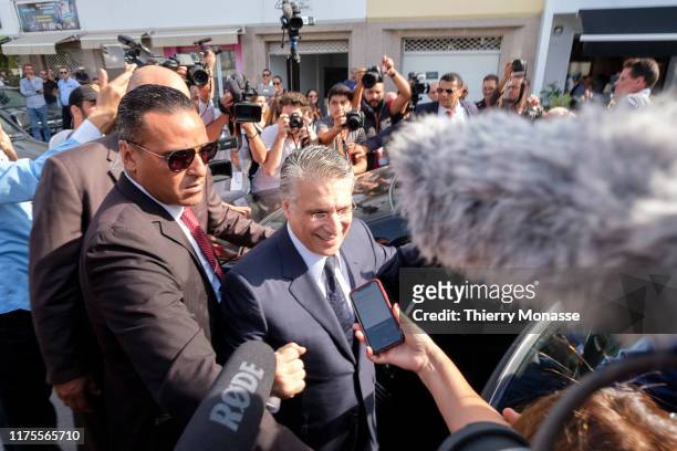 Tunisian presidential candidate, Media mogul Nabil Karoui is talking to media after he casts his ballot during the second round of the presidential...