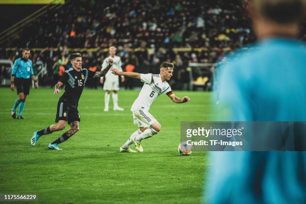Rodrigo de Paul of Argentina and Joshua Kimmich of Germany battle for the ball during the International Friendly between Germany and Argentina at...