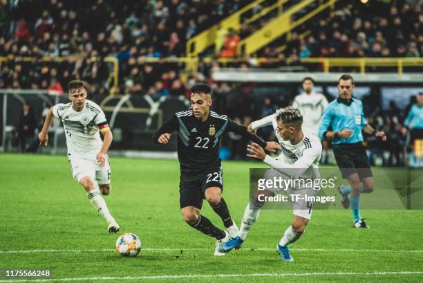 Lautaro Martinez of Argentina and Robin Koch of Germany battle for the ball during the International Friendly between Germany and Argentina at Signal...