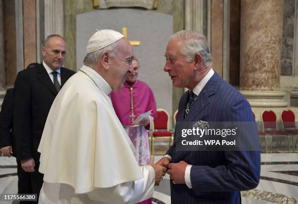 Prince Charles, Prince of Wales shakes hands with Pope Francis during the canonisation of Cardinal Newman held by Pope Francis at St. Peter's Square...