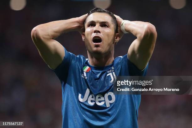 Cristiano Ronaldo of Juventus reacts after missing a chance during the UEFA Champions League group D match between Atletico Madrid and Juventus at...
