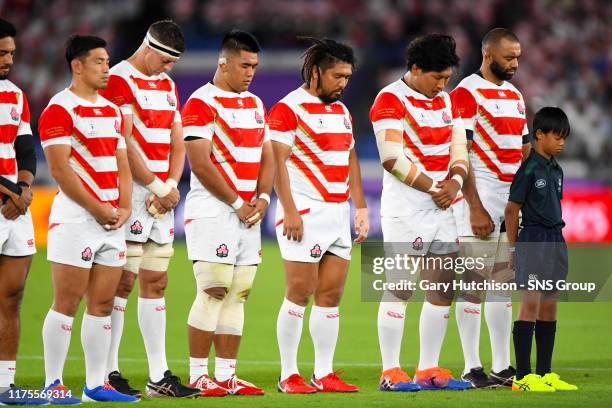 Japan Players during moment of silence for victims of Typhoon Hagibis during the Rugby World Cup 2019 Pool A match between Japan and Scotland at the...