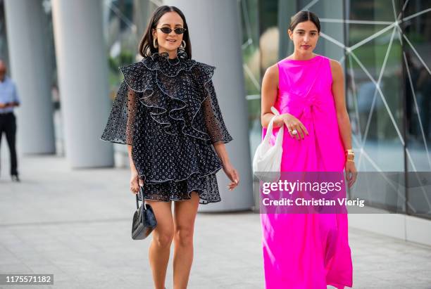 Anna Rosa Vitiello is seen wearing sheer dress, Bettina Looney is seen wearing pink sleeveless dress, white bag outside the Alberta Ferretti show...