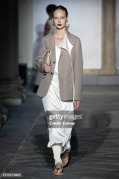 Model walks the runway at the Jil Sander show during the Milan Fashion Week Spring/Summer 2020 on September 18, 2019 in Milan, Italy.