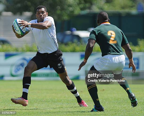 Josateki Lalagavesi of Fiji in action against Mbongeni Mbonambi of South Africa during the IRB Junior World Championship 5th Place Play Off match...