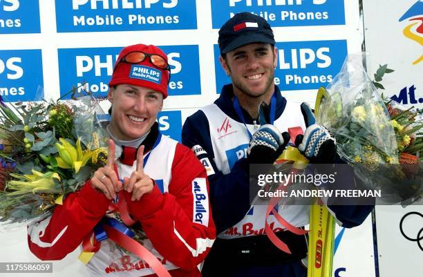 Reigning FIS Freestyle World Cup Champion Jacqui Cooper from Australia and Eric Bergoust from the US celebrate their eleventh World Cup victories...