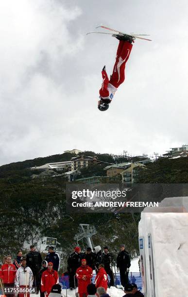 Current World Aerial Freestyle champion Jacqui Cooper from Australia flies upside down through the air above spectators on her way to winning the...