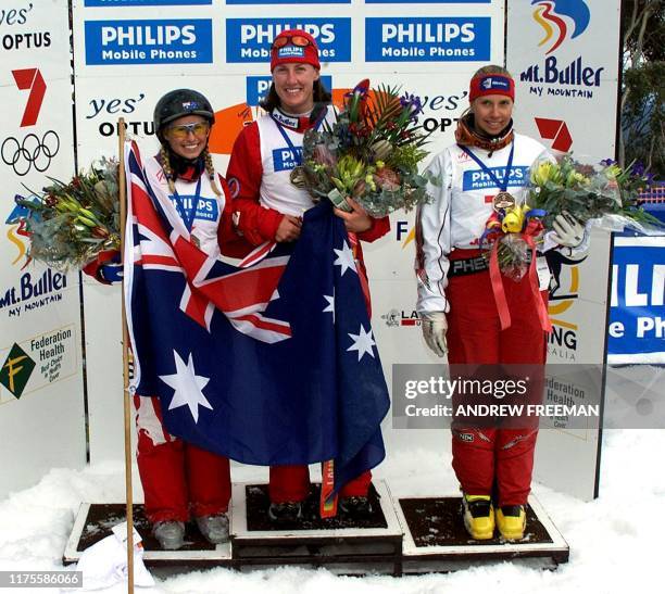 Alisa Camplin from Australia who came second and Veronika Bauer from Canada who came third stand along side current World Aerial Freestyle champion...