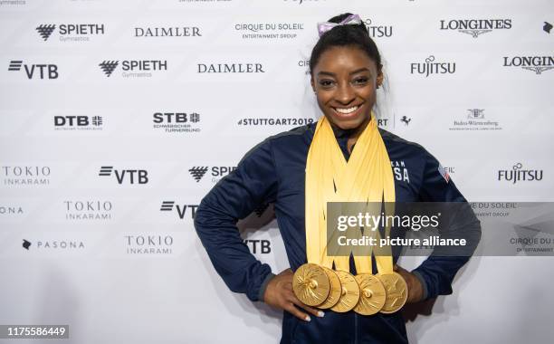 October 2019, Baden-Wuerttemberg, Stuttgart: Gymnastics: World Championships, apparatus finals. Simone Biles from the USA has five gold medals in her...