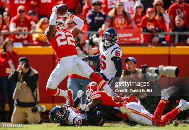 Juan Thornhill of the Kansas City Chiefs intercepts a pass intended for Will Fuller of the Houston Texans on fourth down in the second quarter at...