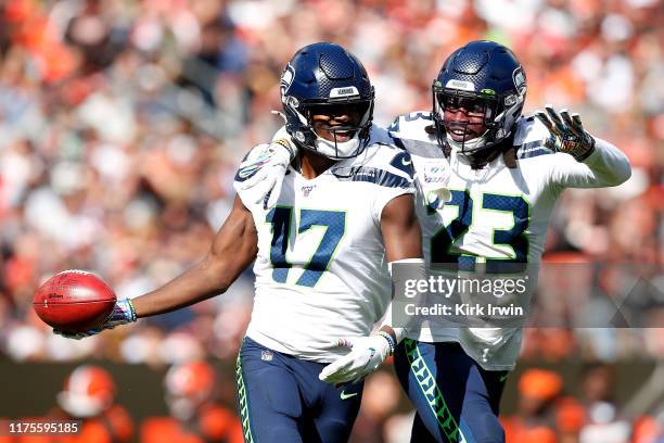 Malik Turner of the Seattle Seahawks and Neiko Thorpe celebrate after a blocked punt by David Moore during the first quarter of the game against the...
