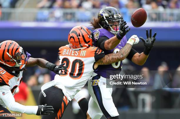 Willie Snead of the Baltimore Ravens is unable to make a catch in front of Jessie Bates of the Cincinnati Bengals during the first half at M&T Bank...