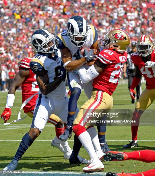 Wide receiver Robert Woods of the Los Angeles Rams gets into the end zone for a touchdown past cornerback Jimmie Ward of the San Francisco 49ers with...