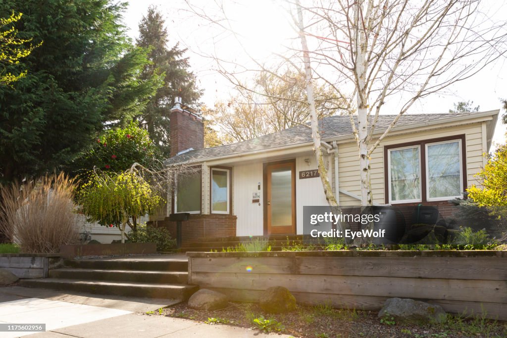 Wide exterior shot of a 1940 style bungalow style house in Portland Oregon.