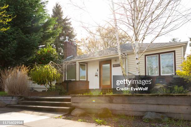 wide exterior shot of a 1940 style bungalow style house in portland oregon. - portland oregon stock-fotos und bilder