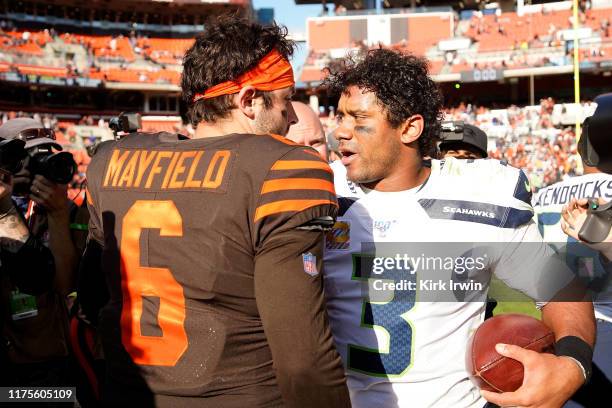 Baker Mayfield of the Cleveland Browns shakes hands with Russell Wilson of the Seattle Seahawks after the game at FirstEnergy Stadium on October 13,...