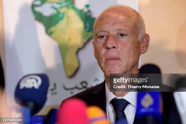 Tunisian presidential candidate Kais Saied talks to media after the first exit poll in presidential runoff vote suggest he is set to become president...