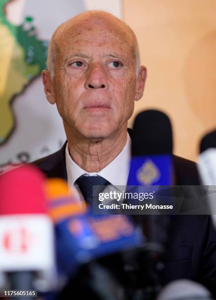 Tunisian presidential candidate Kais Saied talks to media after the first exit poll in presidential runoff vote suggest he is set to become president...