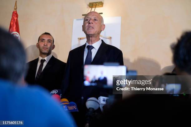 Tunisian presidential candidate Kais Saied talks to media after the first exit poll in presidential runoff vote suggest he is set to become president...