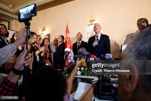 Tunisian presidential candidate Kais Saied talks to media after the first exit poll in presidential runoff vote suggest he is set to become president...