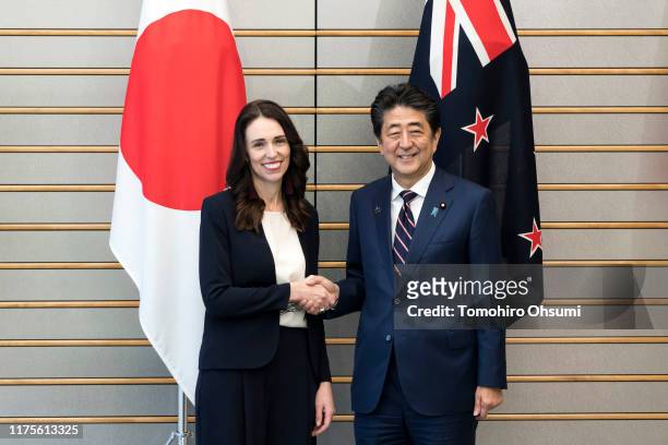 New Zealand Prime Minister Jacinda Ardern shakes hands with Japan's Prime Minister Shinzo Abe prior to their meeting on September 19, 2019 in Tokyo,...
