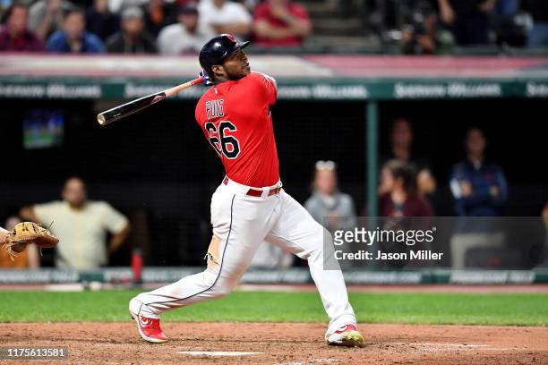 Yasiel Puig of the Cleveland Indians hits a walk-off RBI single to deep right during the tenth inning against the Detroit Tigers at Progressive Field...