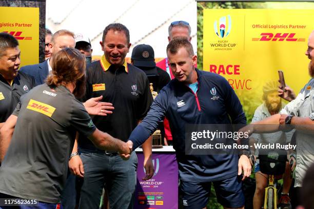 Referee Nigel Owens welcomes cyclists Ron Rutland and James Owens who deliver the official Referee whistle for the opening match of the Rugby World...