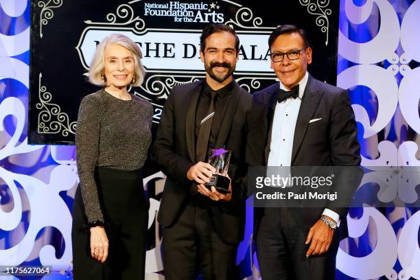 Co-Founders Felix Sanchez and Merel Julia present an award to actor Alfonso "Poncho" Herrera at the National Hispanic Foundation for the Arts' 23rd...
