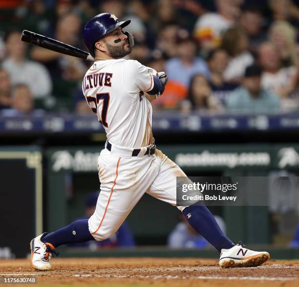 Jose Altuve of the Houston Astros hits a home run in the seventh inning against the Texas Rangers at Minute Maid Park on September 18, 2019 in...