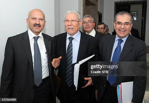 Tunisian Secretary of State Ridha Belhaj, talks with Tunisian Education Minister Taieb Baccouche and Minister Delegate to the prime minister Rafaa...