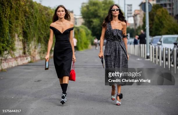 Giorgia Tordini wearing black off shoulder dress and Gilda Ambrosio wearing checkered dress, heels seen outside the Prada show during Milan Fashion...