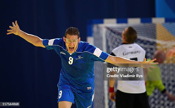 Nikolaos Vessalas of Greece celebrates after scoring a goal during the handball match between Germany and Greece at the Athens 2011 Special Olympics...
