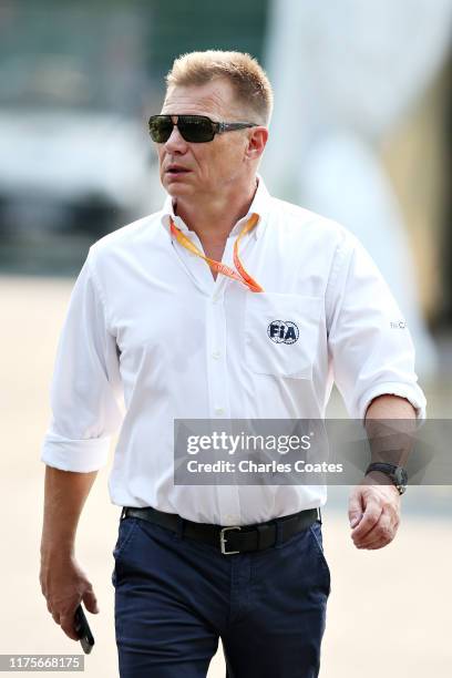 Race steward Mika Salo walks in the Paddock during previews ahead of the F1 Grand Prix of Singapore at Marina Bay Street Circuit on September 19,...