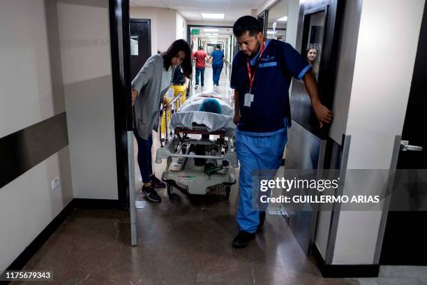 Veronica Merril from Phoenix, Arizona is taken in a stretcher for her bariatric surgery at Hospital Oasis of Hope in Tijuana on October 4 Baja...